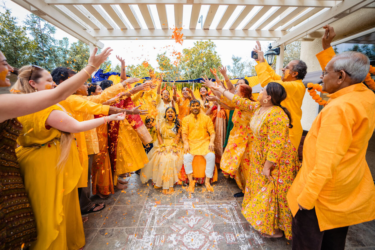 Traditional Indian wedding ceremony with participants in colorful attire performing sacred rituals