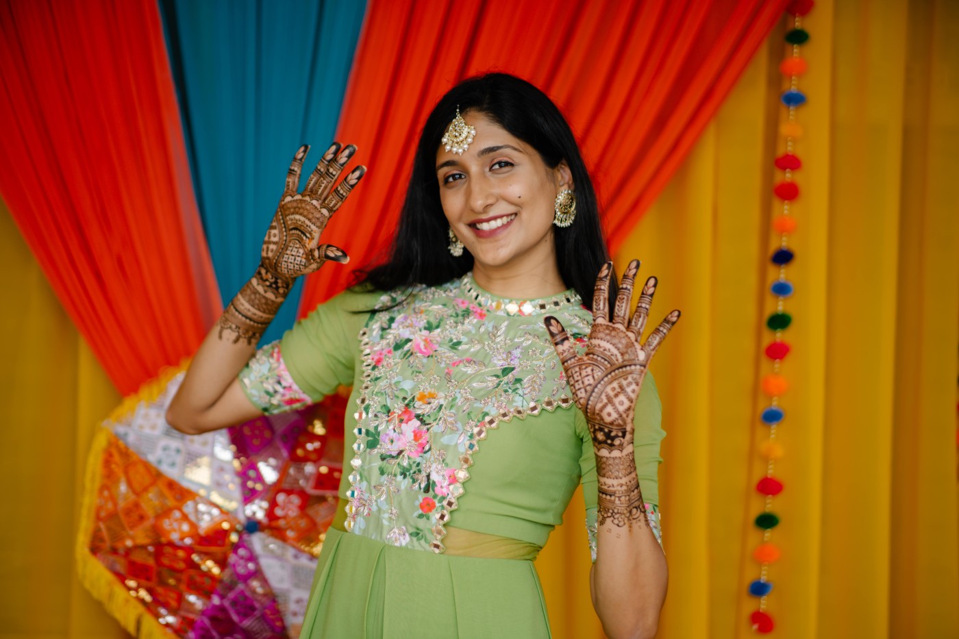 Traditional Indian wedding ceremony with participants in colorful attire performing sacred rituals