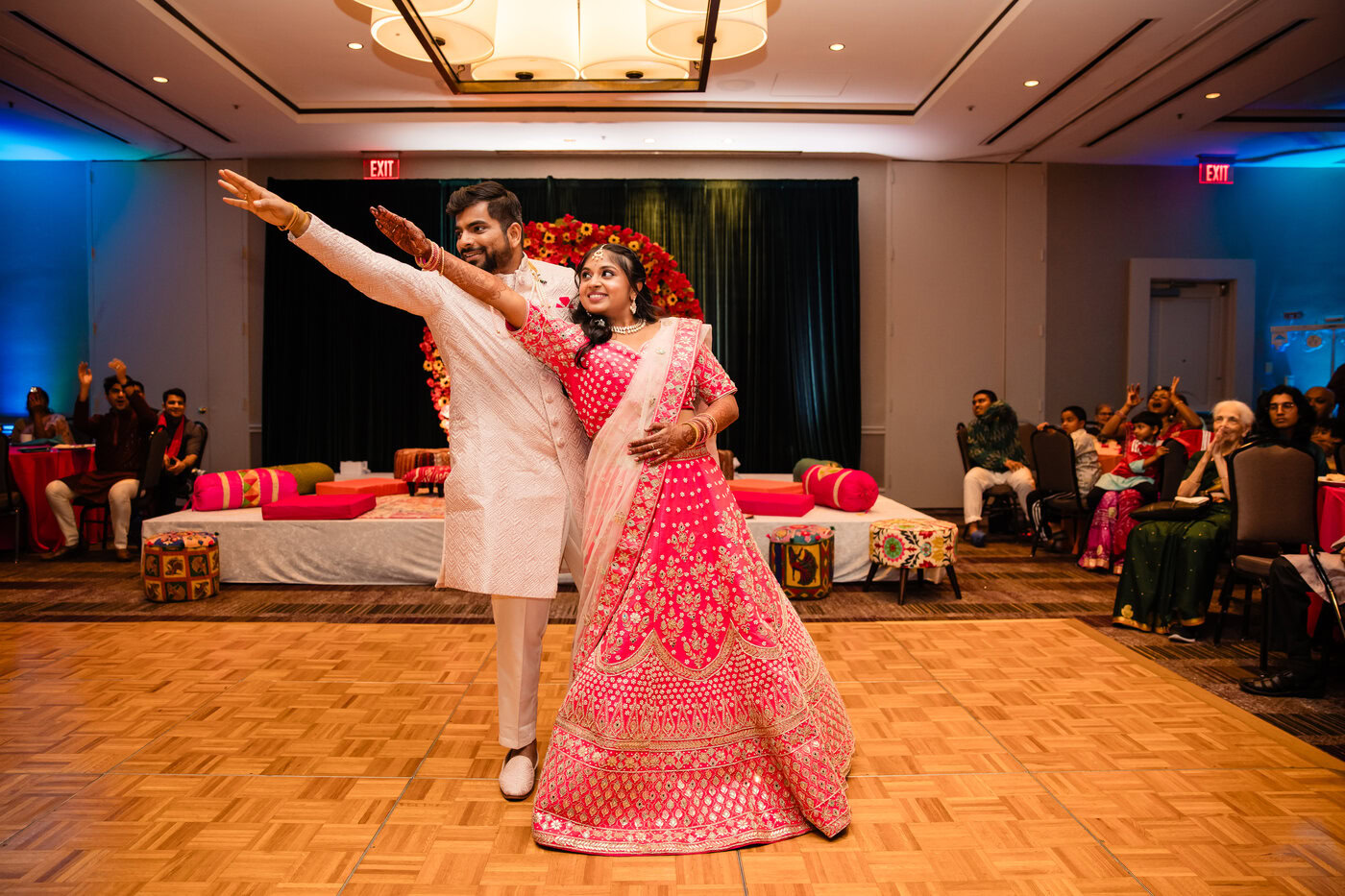Traditional Indian wedding ceremony with participants in colorful attire performing sacred rituals