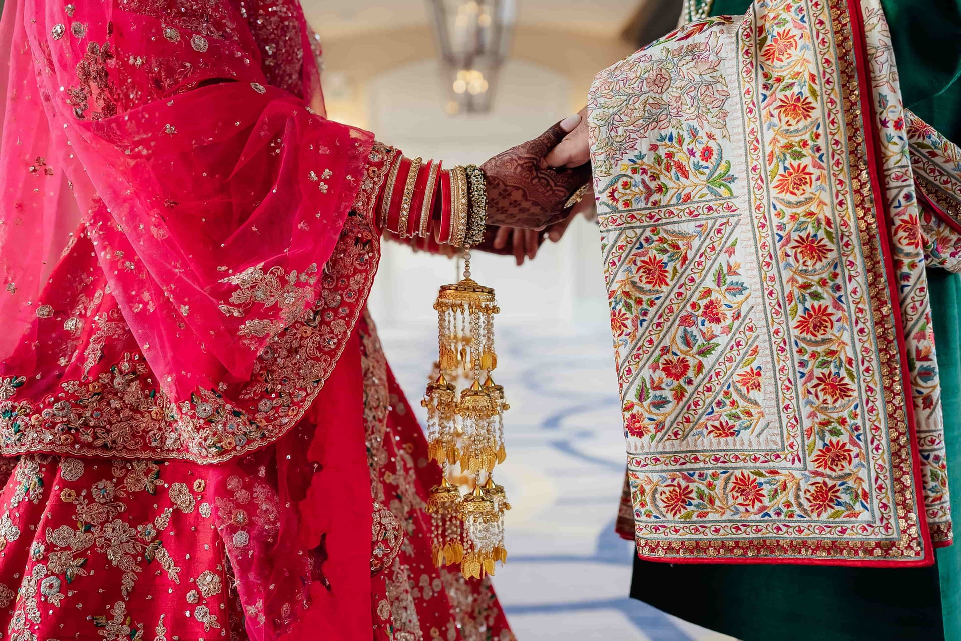 Henna decorated hands with white roses
