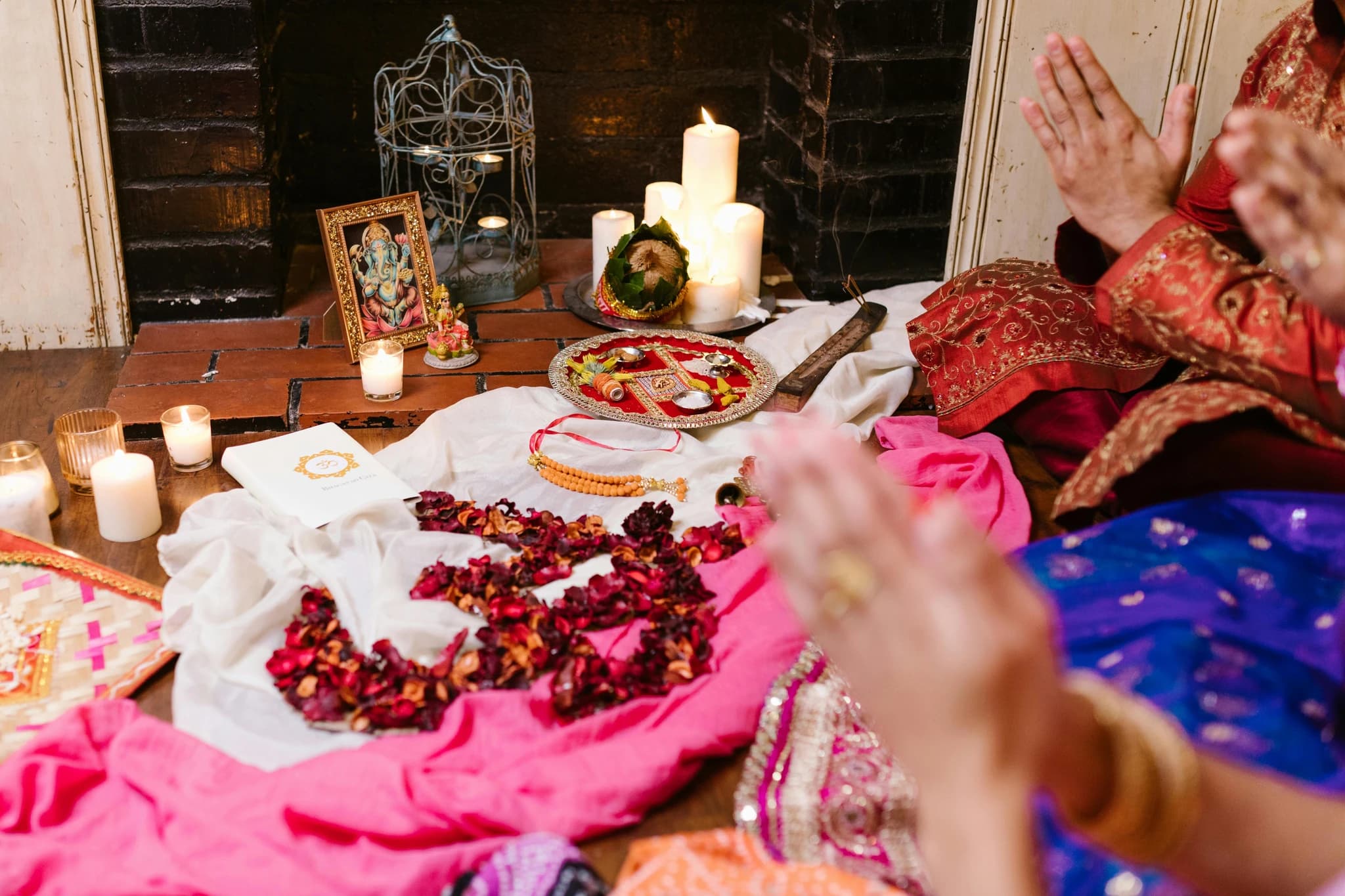 Traditional Indian wedding ceremony with participants in colorful attire performing sacred rituals