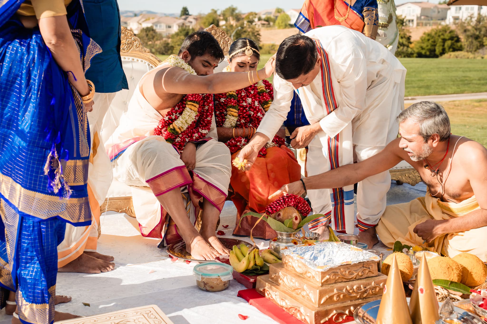Traditional Indian wedding ceremony with participants in colorful attire performing sacred rituals